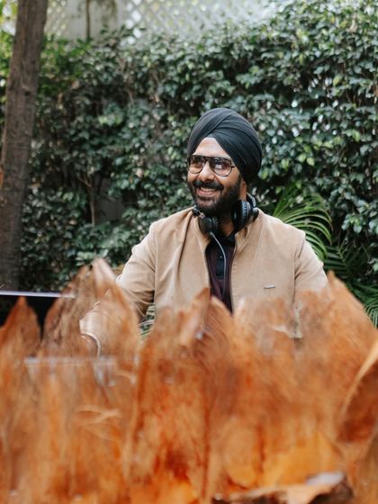 A candid smile from behind the console during a daytime event. I genuinely love what I do, and I think it shows.