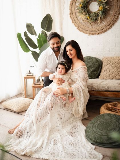 A gorgeous family portrait in a boho-chic setting, full of warmth and style.