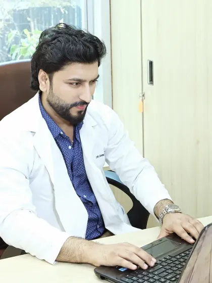 Here I am at my desk, where I review client cases and plan out the best course of treatment. Success in dermatology is the sum of many small, careful efforts repeated every day.