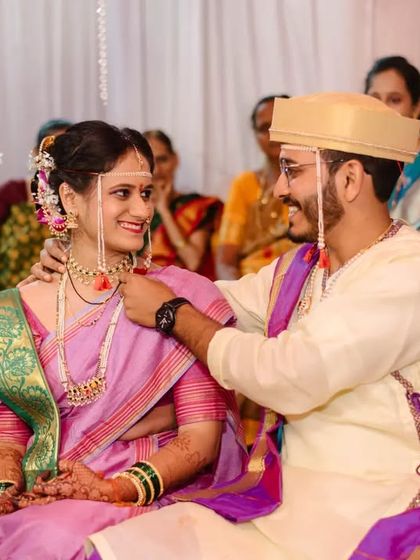 The groom places the 'mangalsutra' around the bride's neck, a pivotal and emotional moment in the ceremony.