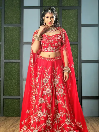 In the studio, I have full control over lighting to make the garment the hero. This powerful pose in a red embroidered lehenga with a cape demonstrates a clean, professional look ideal for e-commerce catalogs and brand campaigns.