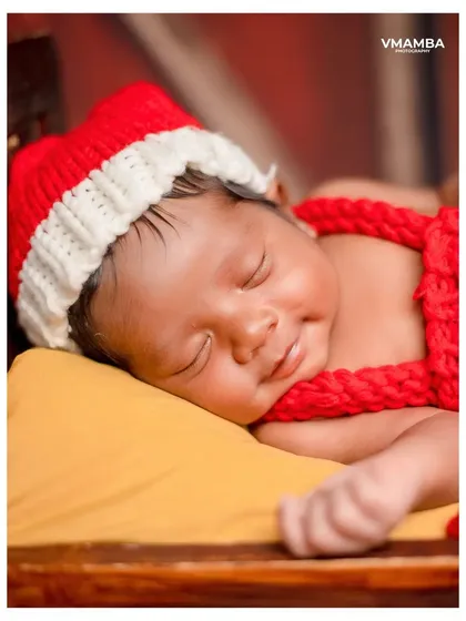 The peaceful smile of a sleeping newborn is just priceless. This close-up from my festive 'Santa' theme captures the pure innocence and sweetness of a baby's first Christmas season.