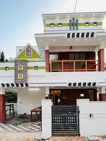 This design showcases a playful yet modern aesthetic with pops of bright green and geometric accents. The structure features a prominent balcony and varied rooflines, creating a distinctive and energetic family home.