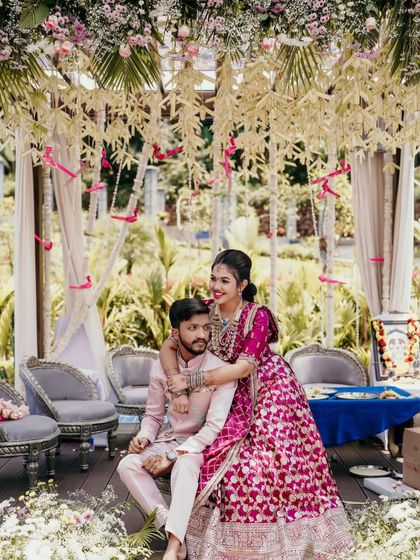 The bride lovingly places her arm around the groom in this sweet engagement portrait.