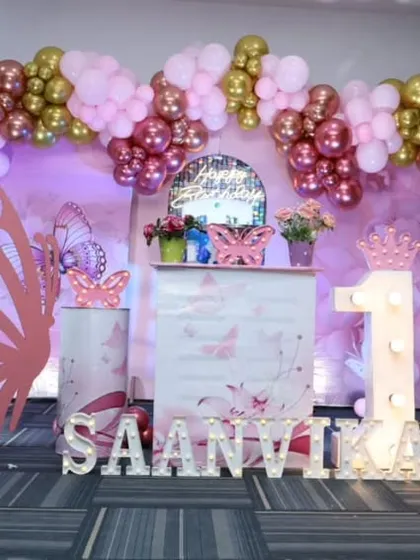 Another angle of the beautiful butterfly-themed first birthday stage.