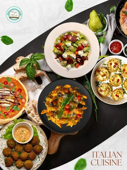 Experience a taste of Italy with our gourmet vegetarian catering. This spread showcases some of our Italian favorites, including artisanal pizza, fresh pasta, flavorful falafel, and a vibrant salad, perfect for a sophisticated dinner party or a casual get-together.