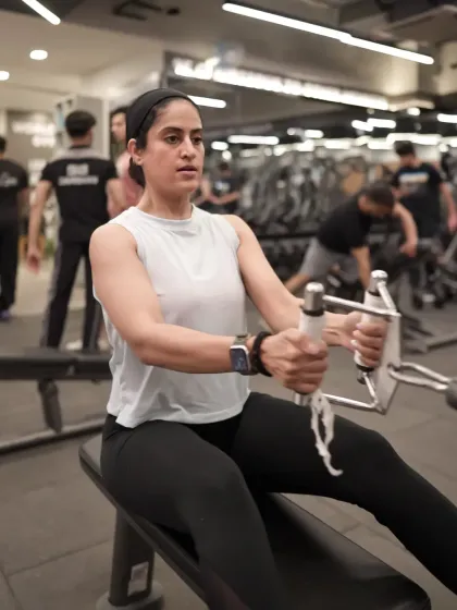 This is the focus and determination you'll find on our gym floor. Our members are committed to their goals, and we provide the premium equipment, like this seated row machine, to help them get there.