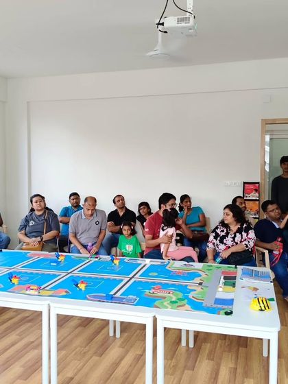 Parents listen attentively during our orientation session at the Whitefield center, learning about the opportunities we offer for their children.