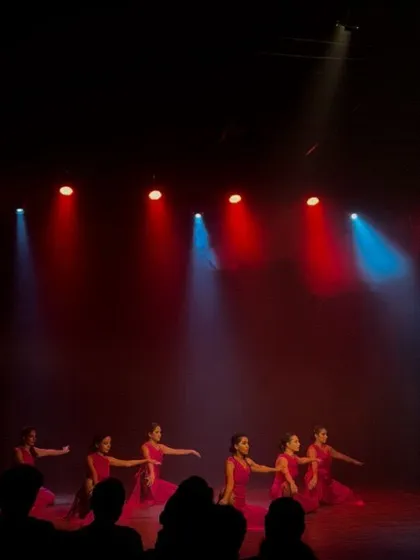 A wide shot of the stage during a performance, showing the impressive scale of our student showcases with beautiful lighting design.