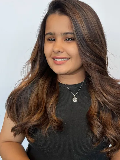 A smiling client happy with her new Matryoshka balayage hair color. Seeing our clients and students happy is the most rewarding part of my job.