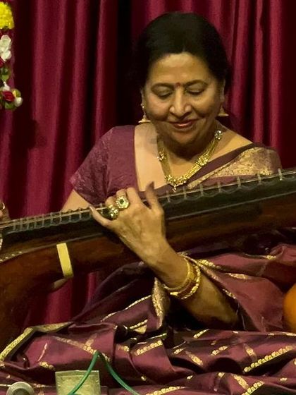 A close-up of me, completely absorbed in the music. This is my world, where every note from the veena tells a story.