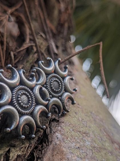 More shots of the beloved moon ear studs. Their intricate design and meaningful symbolism made them a customer favorite. Available for custom order.