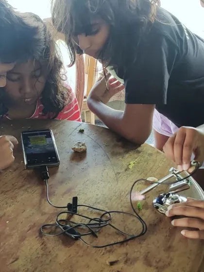 Using a field microscope, the children get a closer look at the tiny organisms that make up the coastal ecosystem. A single drop of seawater is an entire world, and with the right tools, we can begin to understand its complexity and beauty.