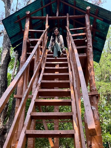 A fun moment climbing a wooden watchtower in the forest park. A different perspective always sparks new ideas.