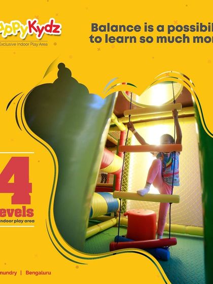 Balance is a key skill, and our play structures are designed to help develop it. Here, a child carefully navigates a ladder bridge, learning and growing through play.