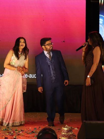 Interacting with our wonderful host on stage during the sangeet. A well-planned event includes moments of interaction and fun games between dance performances.