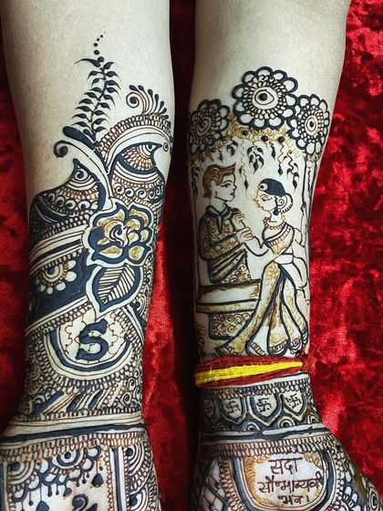 This design for the feet blends personalization with tradition. It features a romantic couple portrait on one leg and a classic floral and peacock design with the initial 'S' on the other.