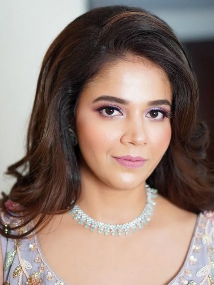 Nilofar's engagement makeup, looking straight on. The subtle shimmer and soft colors enhance her features beautifully without feeling heavy, perfect for a long evening of celebration.