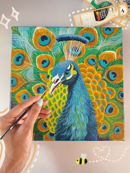 Here, I'm adding the final touches to a vibrant peacock portrait. This flat-lay view shows the rich texture of the canvas and the bright acrylic paints I use to bring the bird's character to life.