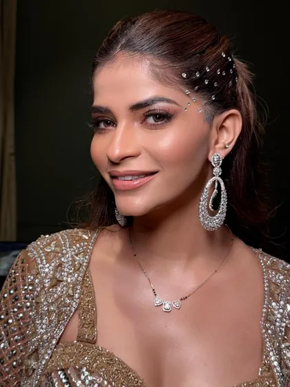 The final look for the Sufi night, with a side-swept high ponytail adorned with a scatter of delicate crystals for a starry effect.