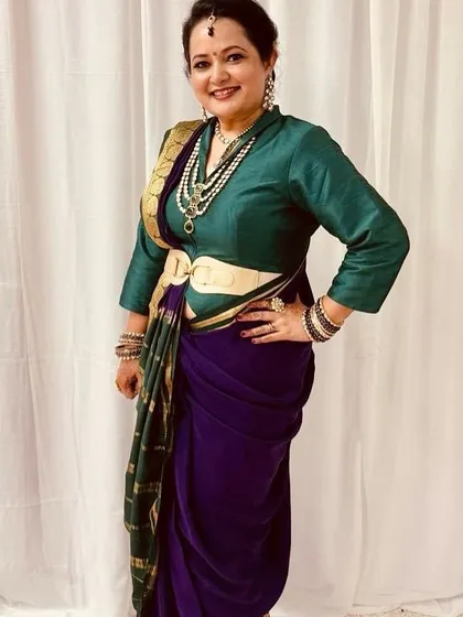 It brings me so much joy to see my clients shine. This beautiful client is wearing a custom-fitted Nauvari-style draped saree, complete with a matching belt and a perfectly coordinated silk blouse, showcasing a complete, personalized ethnic look.