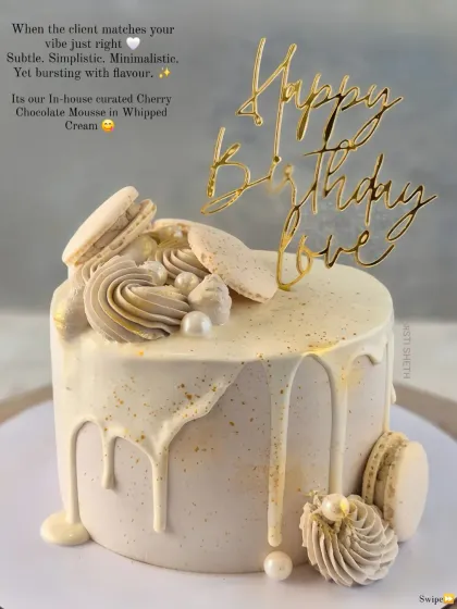 An elegant drip cake in a monochrome palette, decorated with macarons. This is my Cherry Chocolate Mousse flavour.
