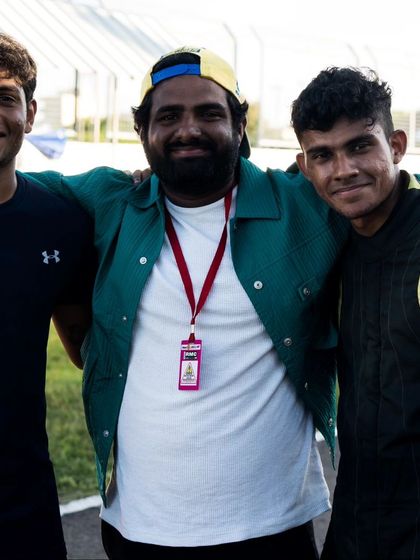 Our drivers and coaches share a moment after a successful race weekend.