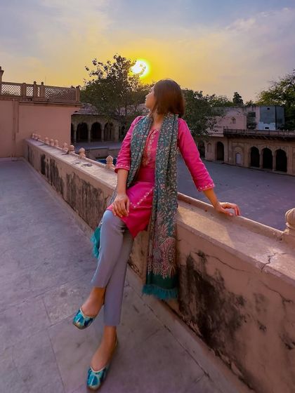 Watching the sunset from the palace rooftop. This is the kind of serene, beautiful moment that a perfect outfit can make even more special.