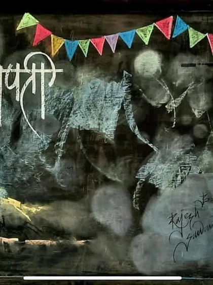 The complete blackboard art piece, "Raja Shivchhatrapati," combining his portrait with a depiction of his fort.