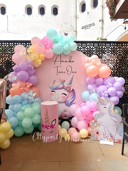 The full setup for the unicorn first birthday, designed for an outdoor or semi-outdoor venue.