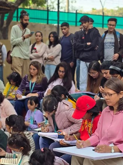 Students of all ages listen intently during a demonstration at our outdoor workshop, all eager to learn new techniques.