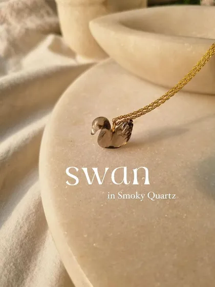 A closer look at the smoky quartz swan pendant. It's a beautiful charm for emotional calmness and relieving stress.
