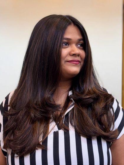 Introducing the Mocha Musses trend. This is our latest hair color obsession, featuring deep mocha tones with subtle highlights for a chic and modern look.