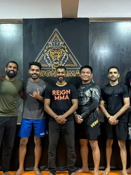 The core coaching team and senior members on our last day. These walls hold countless memories of blood, sweat, and victories.