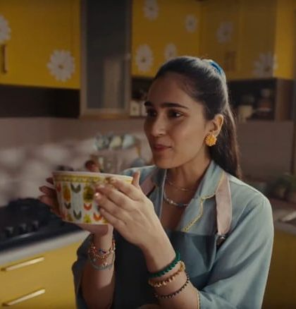 Another kitchen moment from the Chumbak ad, with the actress styled in a lovely blue pajama set and a practical yet stylish apron.