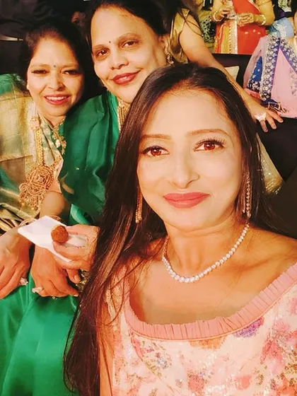 A group selfie with guests who were clients from years ago. It feels like a family reunion when I see so many familiar, smiling faces in the crowd.