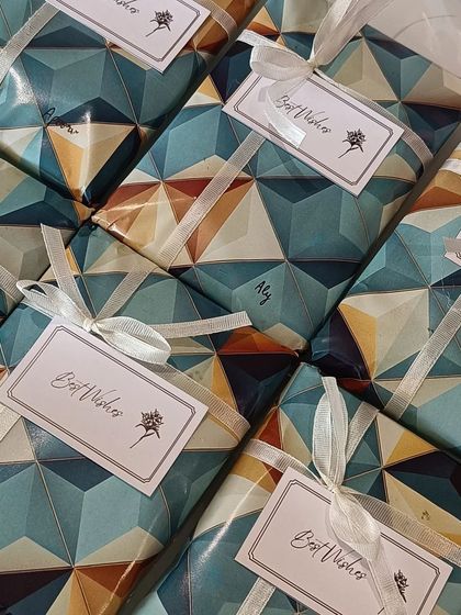 Custom passport covers are a fantastic and useful gift for anyone who loves to travel. This image shows a batch of covers I prepared, each with a personalized nameplate, ready to be gifted. The minimalist packaging keeps it sleek and modern.