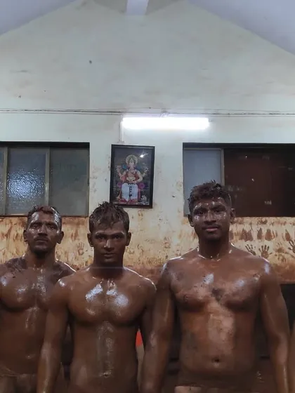 After a tough session, our wrestlers stand together, covered in the sacred red soil. This is a testament to their hard work and the strong bond forged within the akhada.