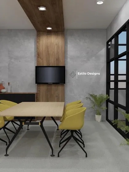 This conference room was designed with an industrial aesthetic. I used concrete-finish walls, exposed-style lighting, and a glass partition to create a modern and professional meeting space, with a pop of color from the chairs.