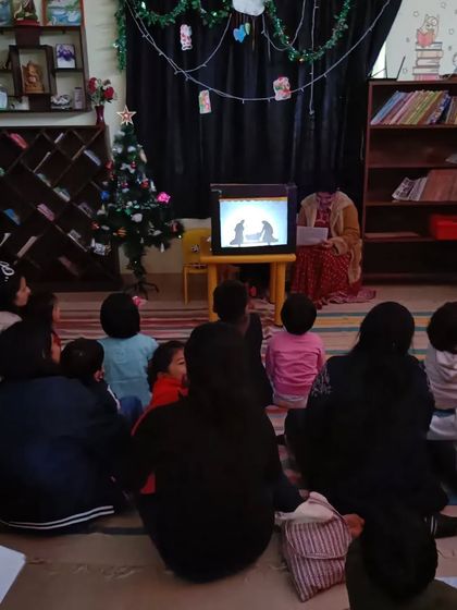 A duplicate of image 297, showing the audience captivated by the nativity story.