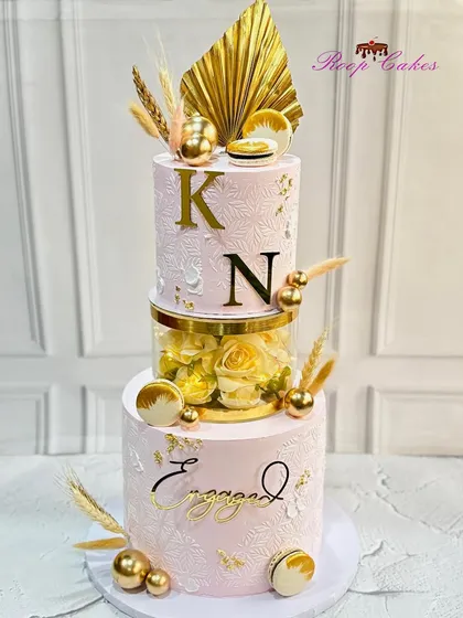 Sweet beginnings and endless love. This is another version of my most-loved engagement cake design, featuring a floral separator and personalized with the couple's initials.