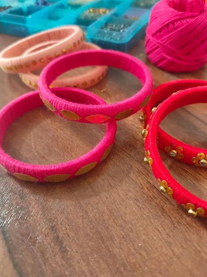 A glimpse of my work-in-progress materials. You can see colorful fabric components, beads, threads, and hand-painted pieces all waiting to be turned into beautiful jewelry.