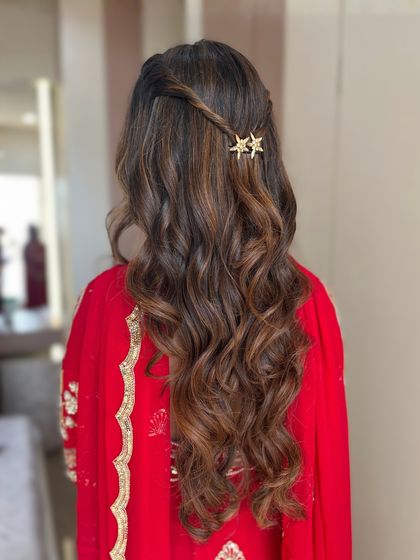 For a modern, soft glam look, we created these beautiful, flowing waves. The simple star-shaped hair clips add a touch of whimsical charm.