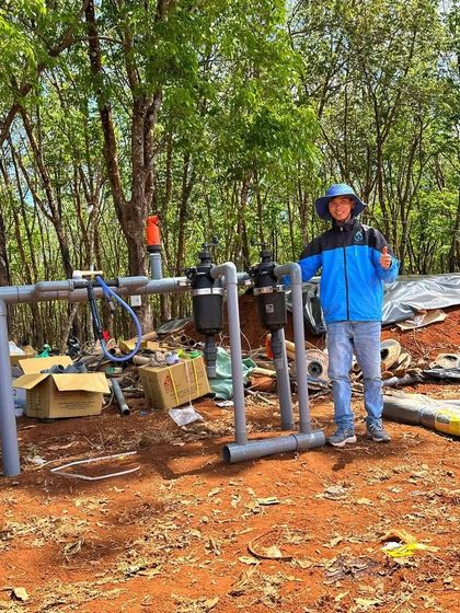 A successful installation in Vietnam. Our customer stands proudly with his new semi-automatic filtration system, ready to improve his farm's efficiency and crop health.