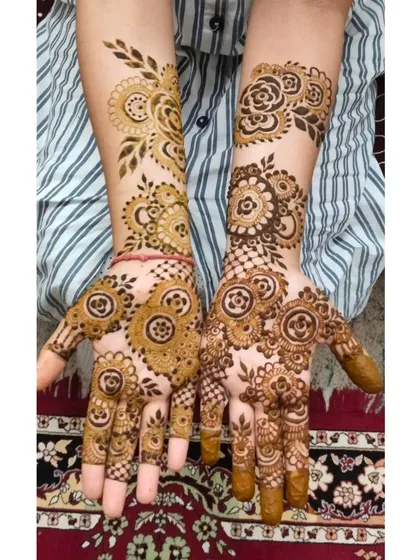 A great example of custom designs. Each hand features a different pattern, combining mandalas, florals, and leafy vines, all drawn with a steady hand and my smooth henna paste.
