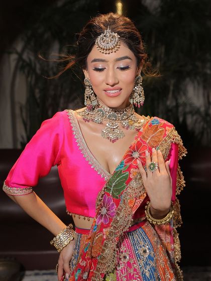 A candid and happy moment. The makeup is designed to look beautiful and radiant, even in motion, perfect for a night of dancing.