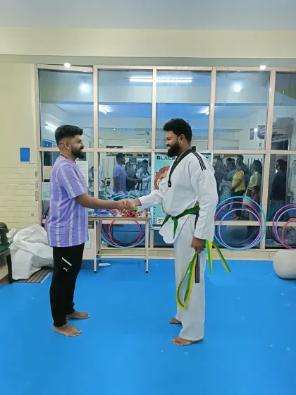 A handshake between students and coaches.