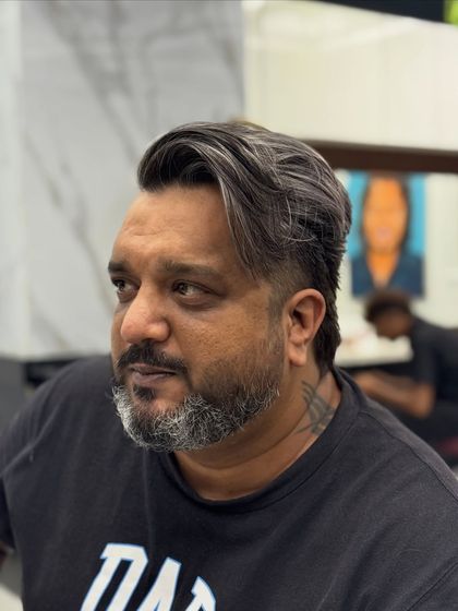 A side profile of the finished salt and pepper look. The blend of silver and black is seamless and classy.