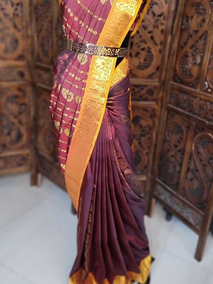 The complete look on the mannequin. Learning on a mannequin helps students understand the structure and flow of the drape before trying it on a person.