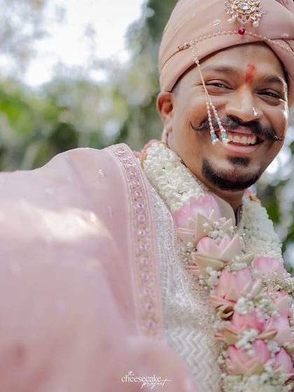A close-up of the groom's happy face during his baraat.